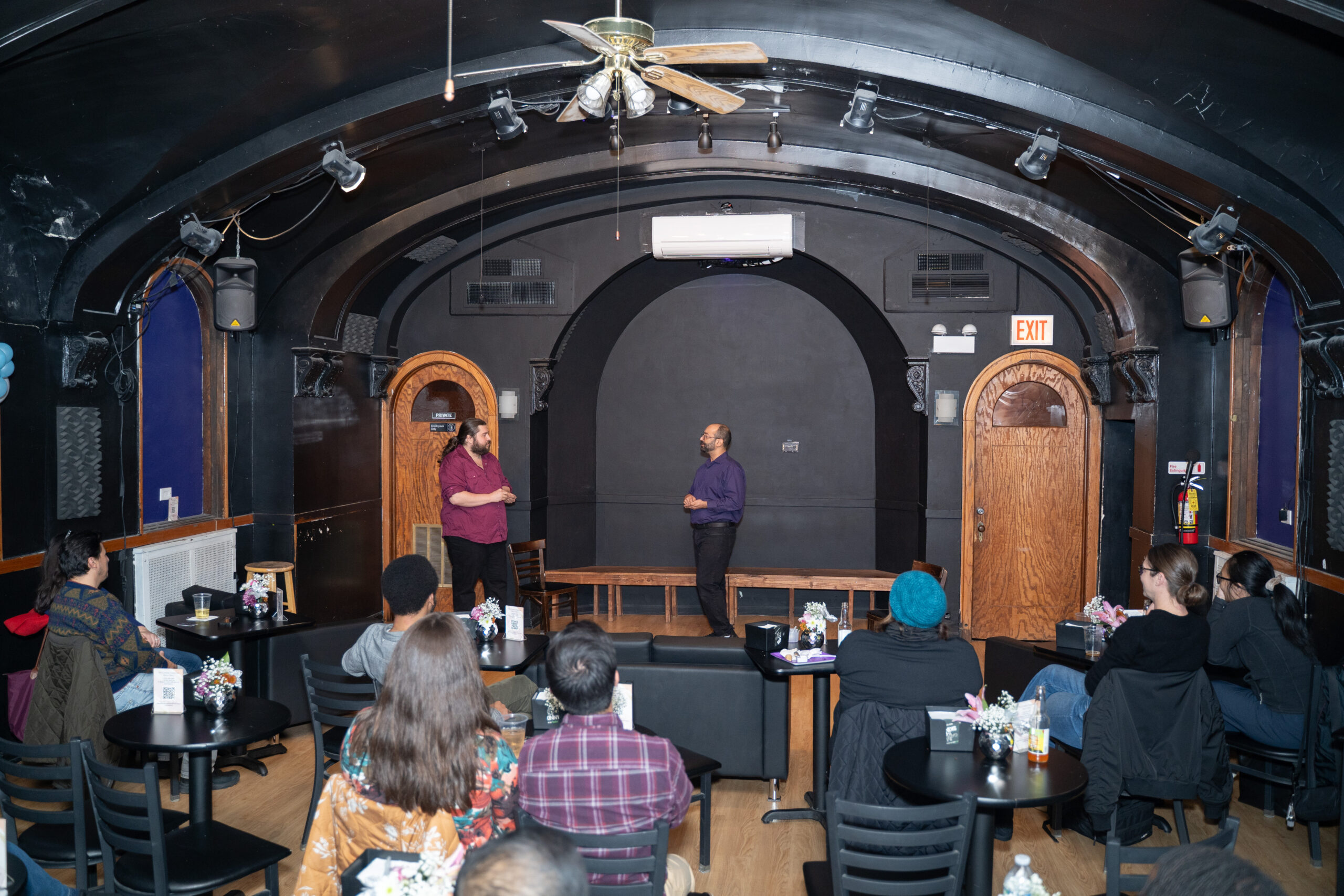 An audience watching two people on stage at Comedy Clubhouse in Wicker Park.